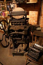A restored 19th century printing press and typewriter found in the gift shop